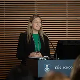 A person speaking at a podium